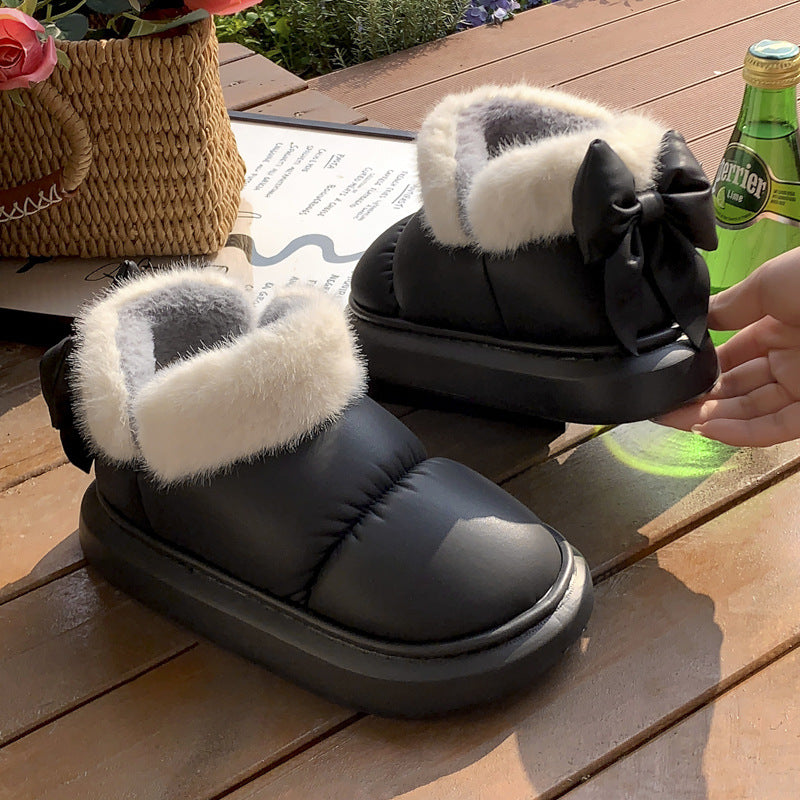 Women's winter ankle boots with thick sole and bow detail