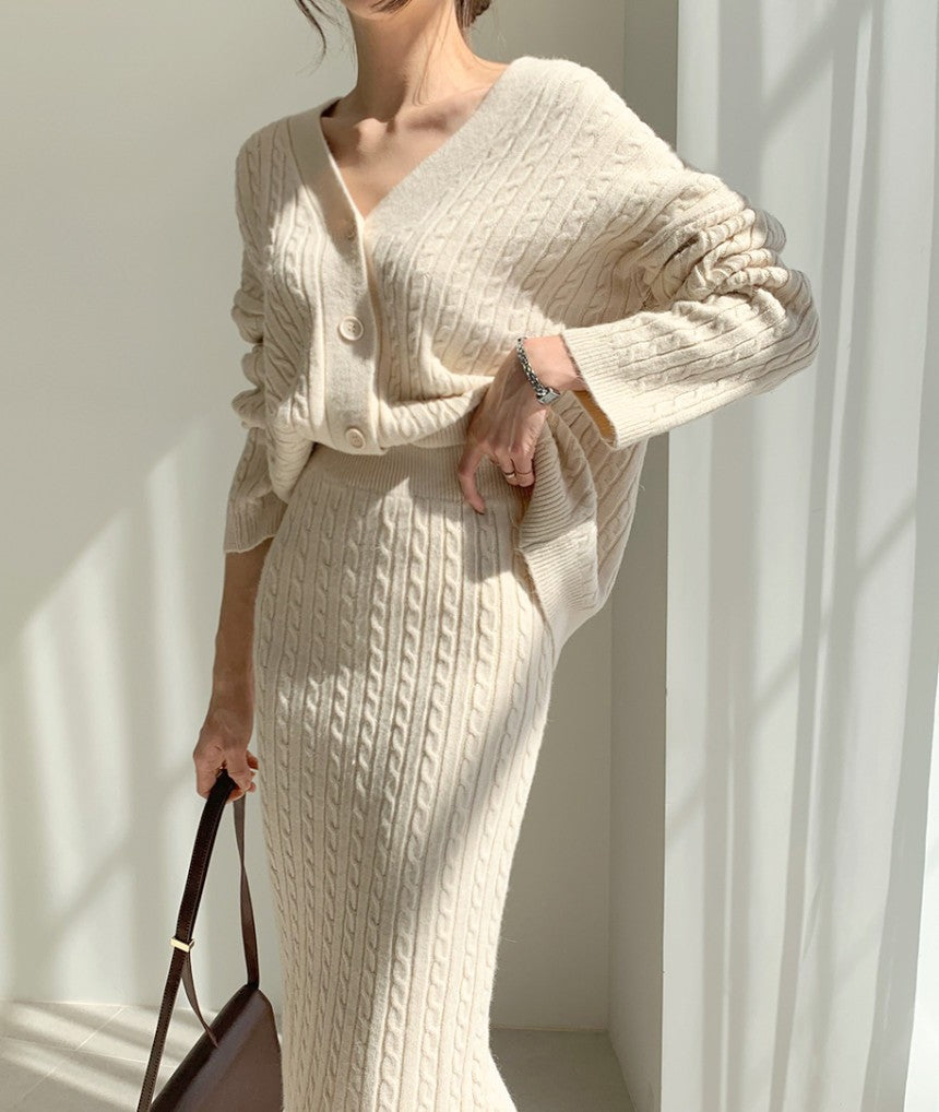 Woman wearing apricot knit sweater set with matching skirt