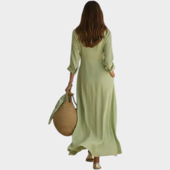 Woman in button front maxi dress with long sleeves