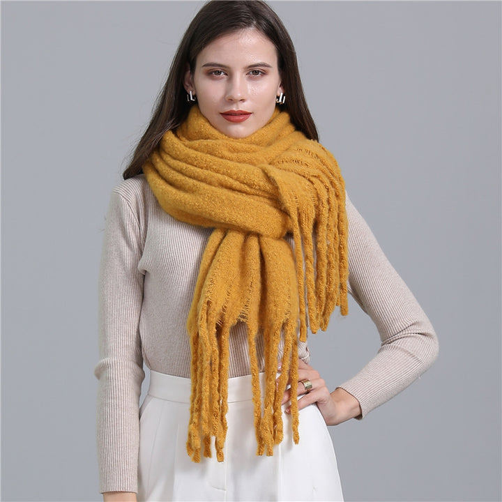 Women's long solid color winter scarf with tassel ends
