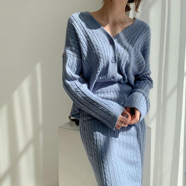 Woman wearing apricot knit sweater set with matching skirt