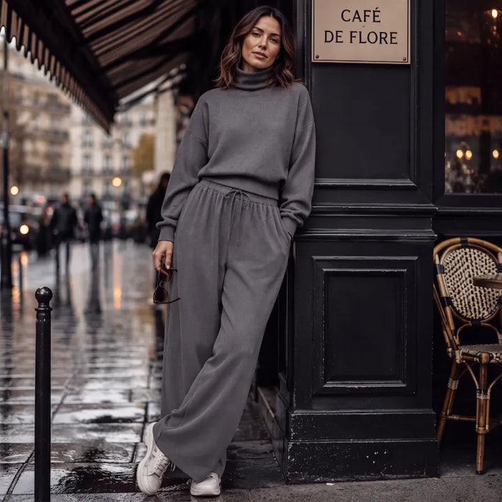 Woman wearing turtleneck two piece set with wide-leg pants