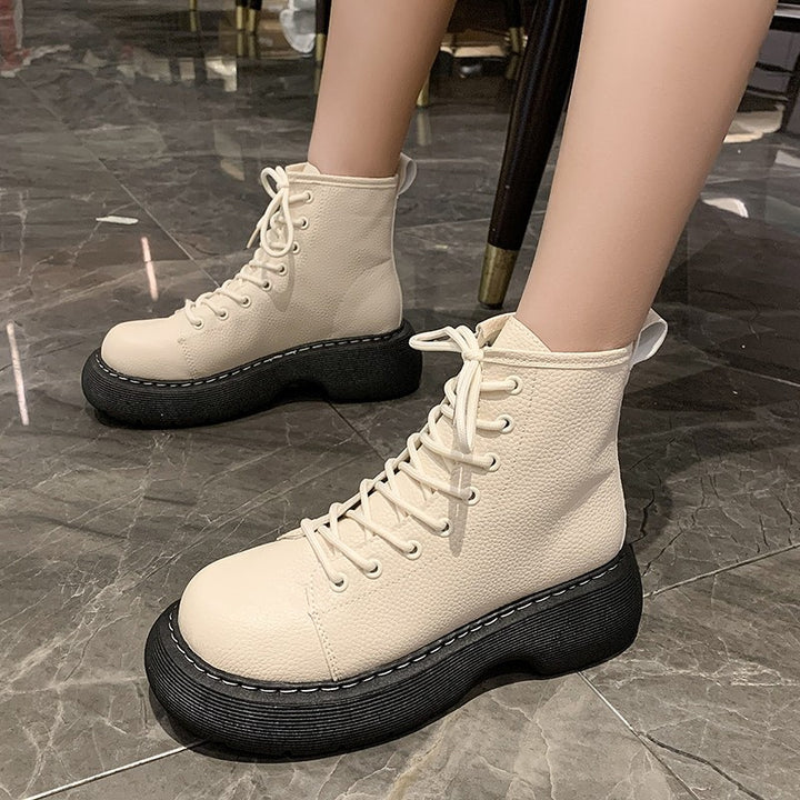 Women's black lace-up ankle boots with flat heel and round toe