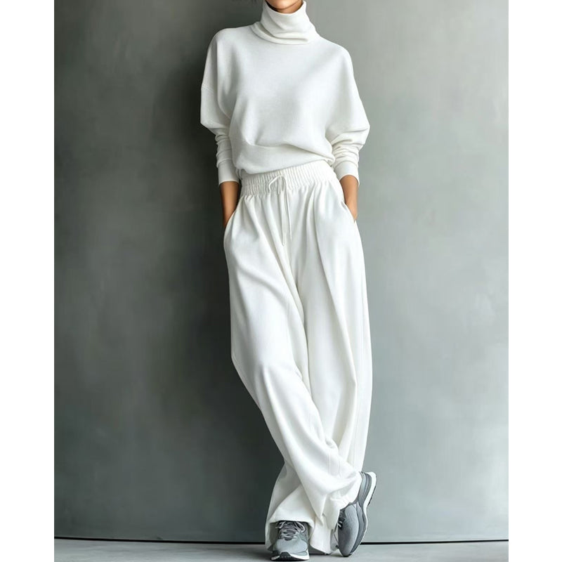 Woman wearing turtleneck two piece set with wide-leg pants