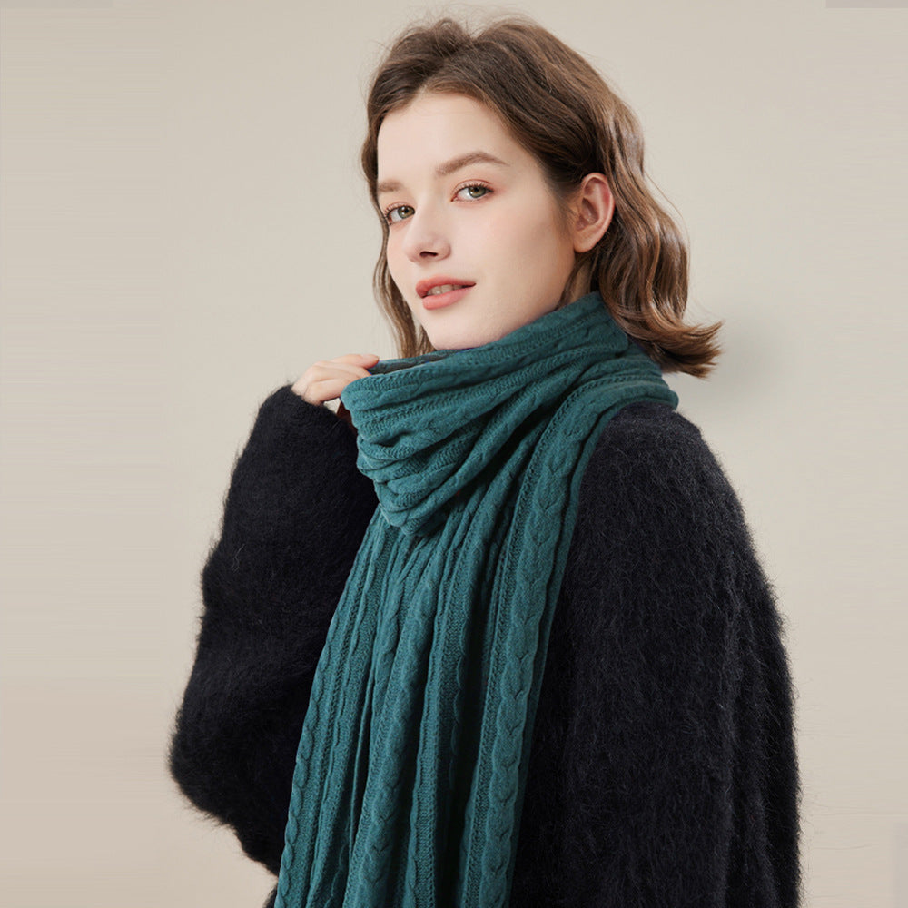 Woman wearing solid color long winter scarf outdoors