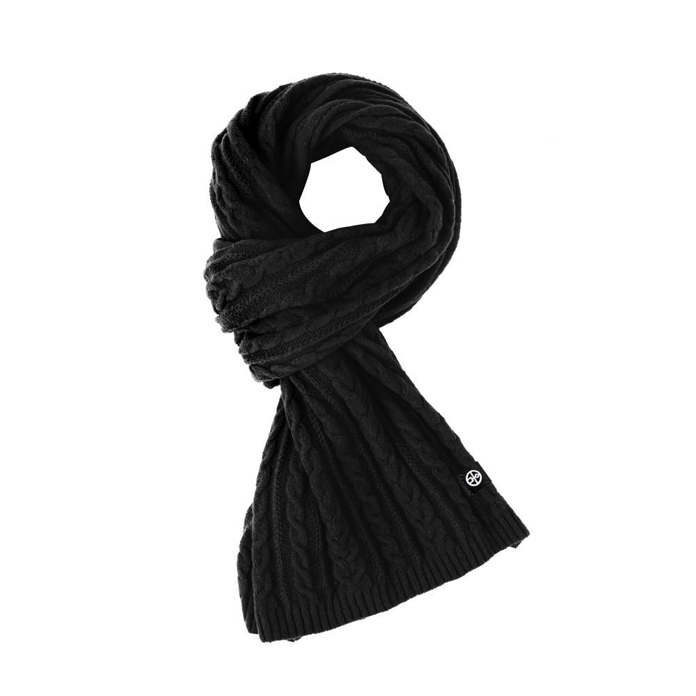 Woman wearing solid color long winter scarf outdoors
