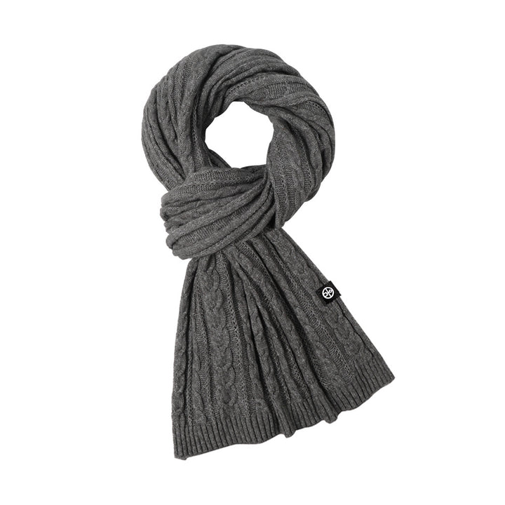 Woman wearing solid color long winter scarf outdoors