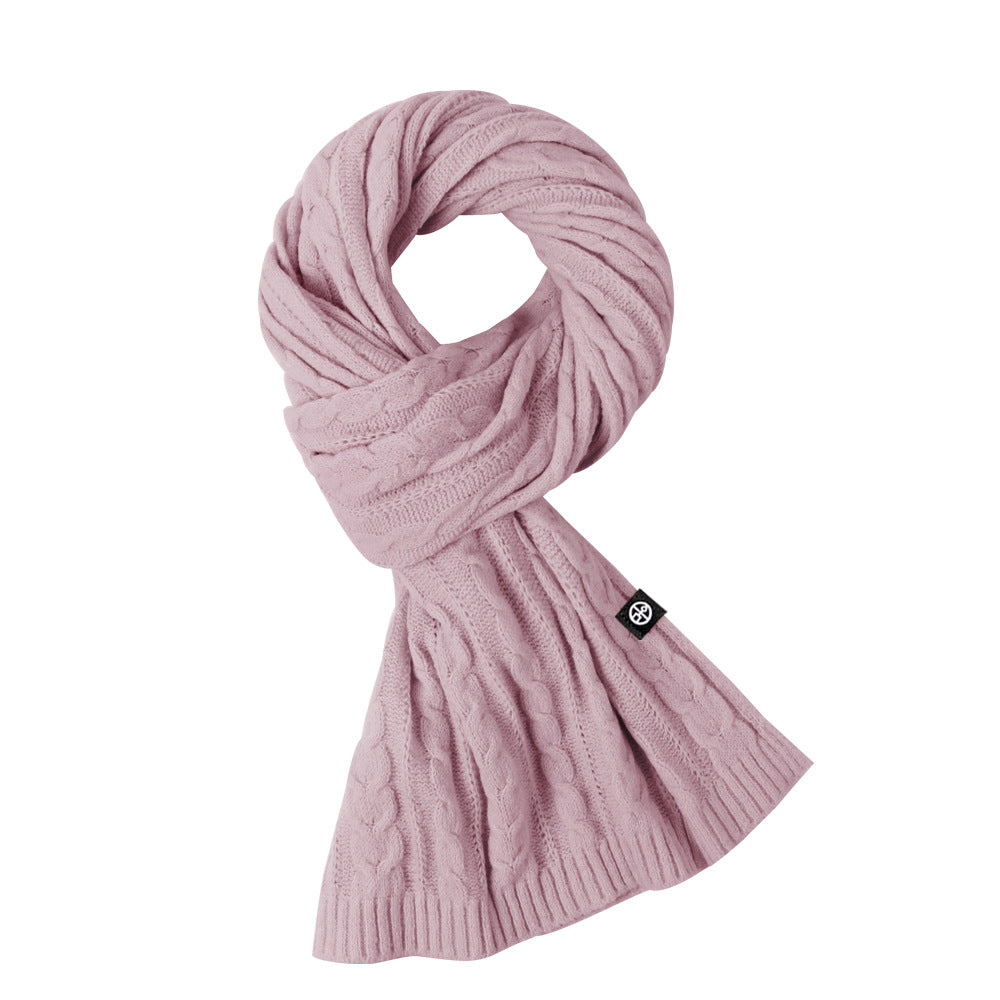 Woman wearing solid color long winter scarf outdoors