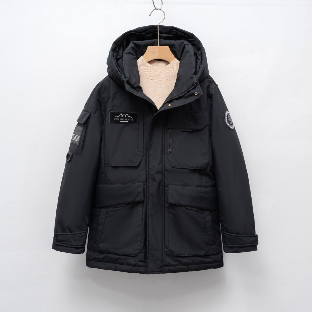 Woman wearing black hooded padded winter parka jacket outdoors