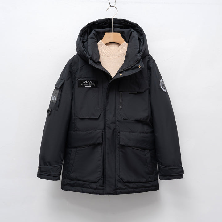 Woman wearing black hooded padded winter parka jacket outdoors