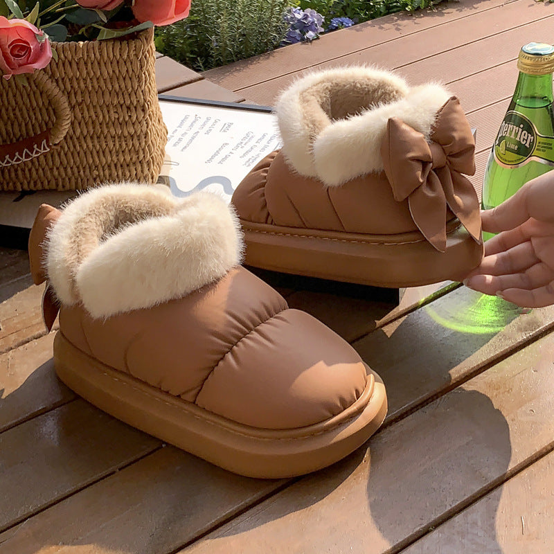 Women's winter ankle boots with thick sole and bow detail