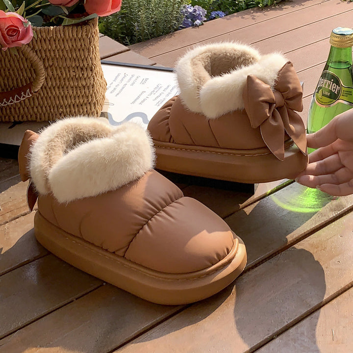 Women's winter ankle boots with thick sole and bow detail