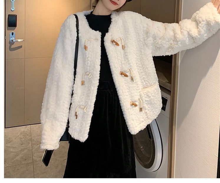 Woman wearing white short coat with long sleeves