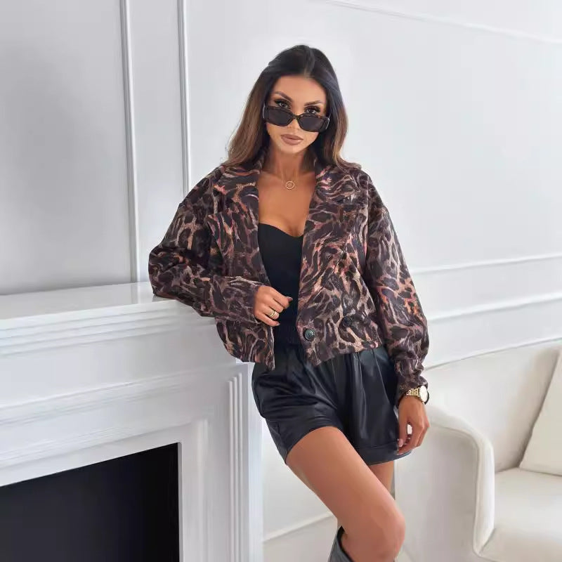 Woman wearing short leopard print blazer with long sleeves