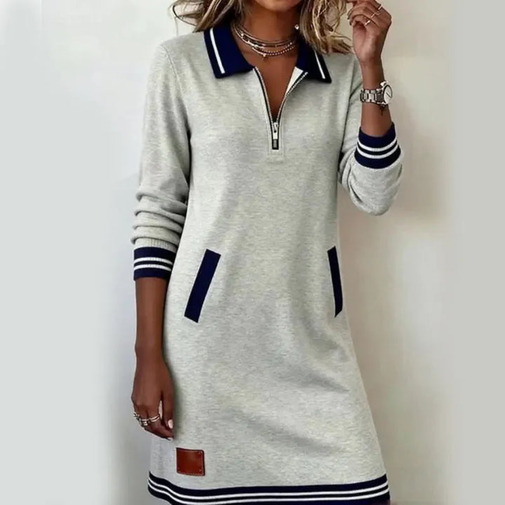 Women's polo dress with quarter-zip collar and front pockets