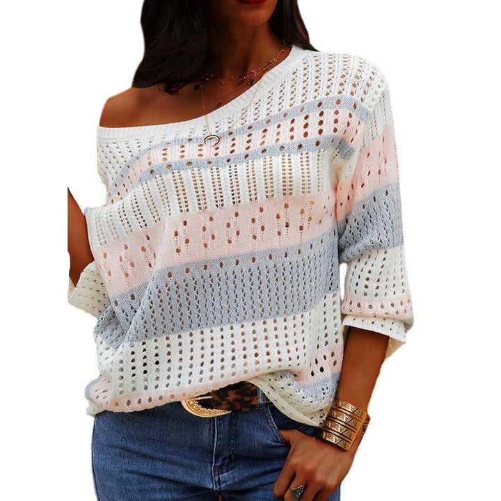 Pink loose striped knit sweater on model