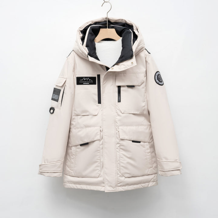 Woman wearing black hooded padded winter parka jacket outdoors
