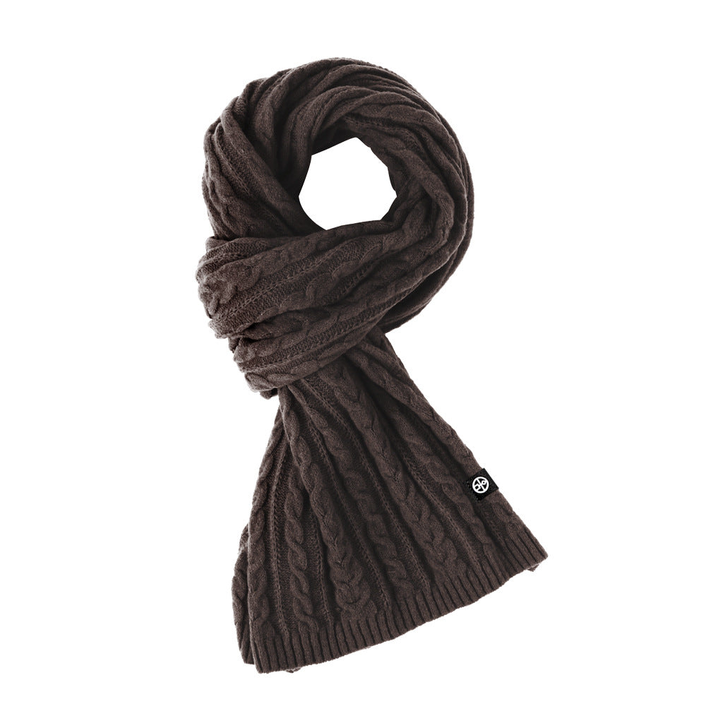 Woman wearing solid color long winter scarf outdoors