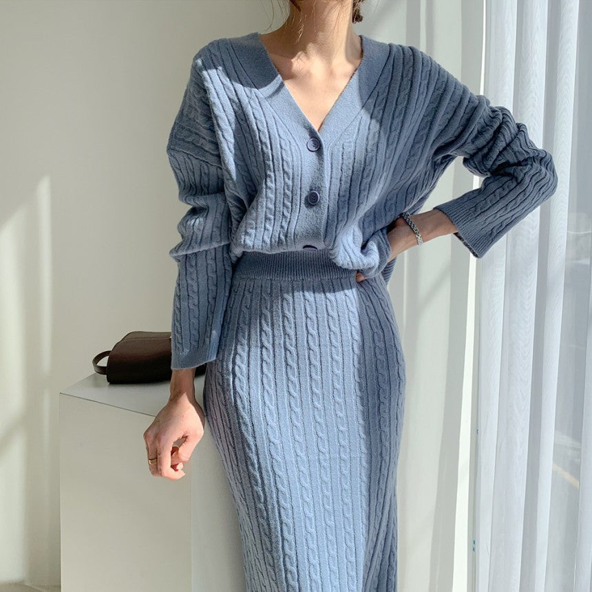 Woman wearing apricot knit sweater set with matching skirt