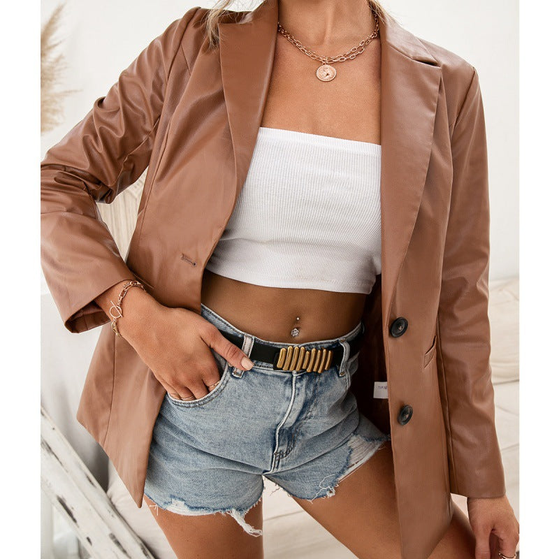 Woman wearing brown faux leather moto jacket with suit collar