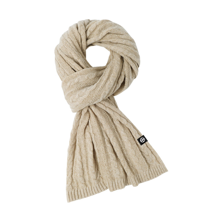 Woman wearing solid color long winter scarf outdoors