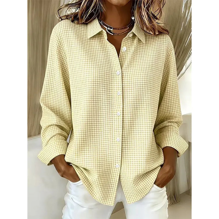 Woman wearing gingham button front long sleeve blouse
