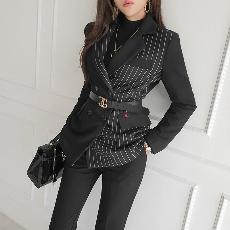 Woman wearing black striped blazer and slim pants set