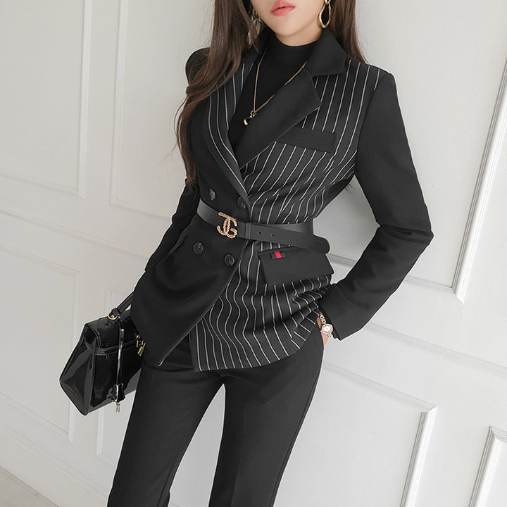 Woman wearing black striped blazer and slim pants set
