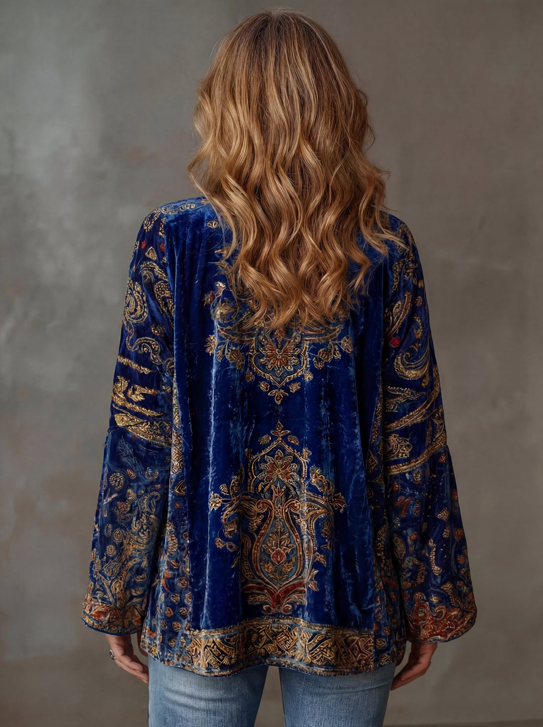 Woman wearing boho kimono jacket with open front