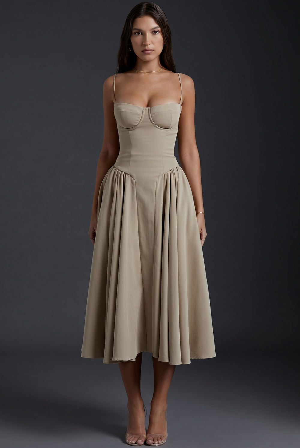 Woman in midi dress with structured bodice and flared skirt