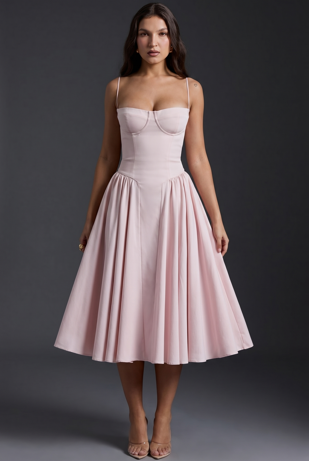 Woman in midi dress with structured bodice and flared skirt