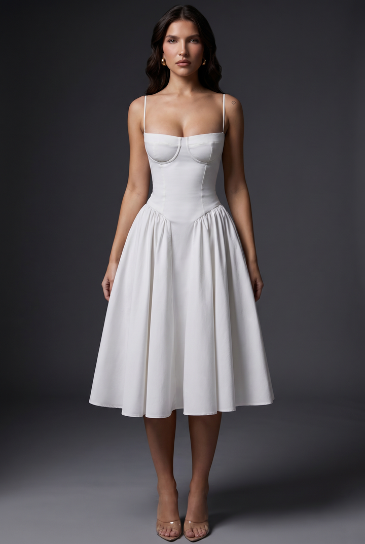 Woman in midi dress with structured bodice and flared skirt