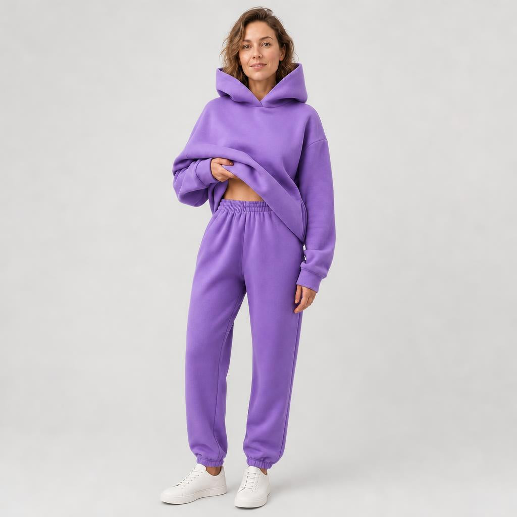 Woman wearing a hooded jogger set with elastic waist – purple, worn by a model