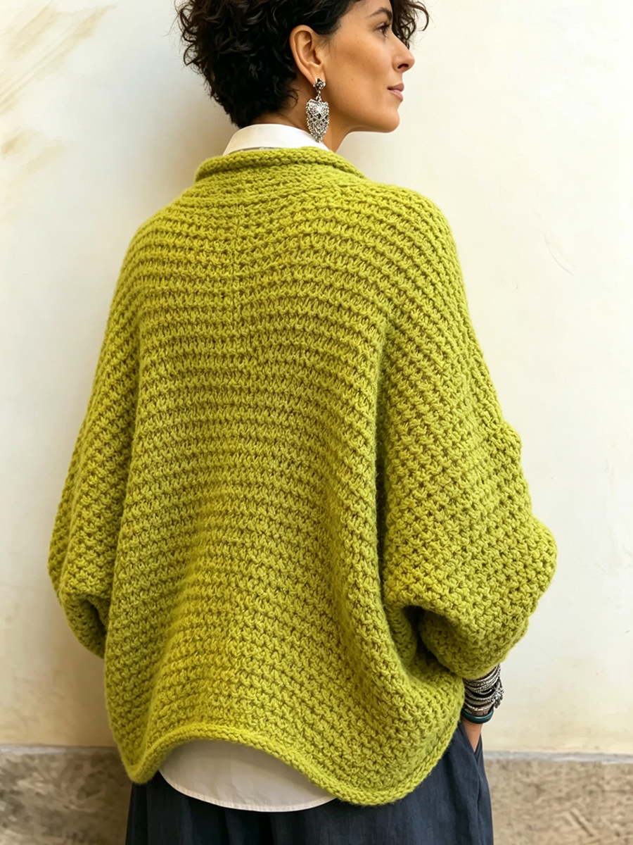 Woman wearing batwing crossover v-neck sweater in fall outfit