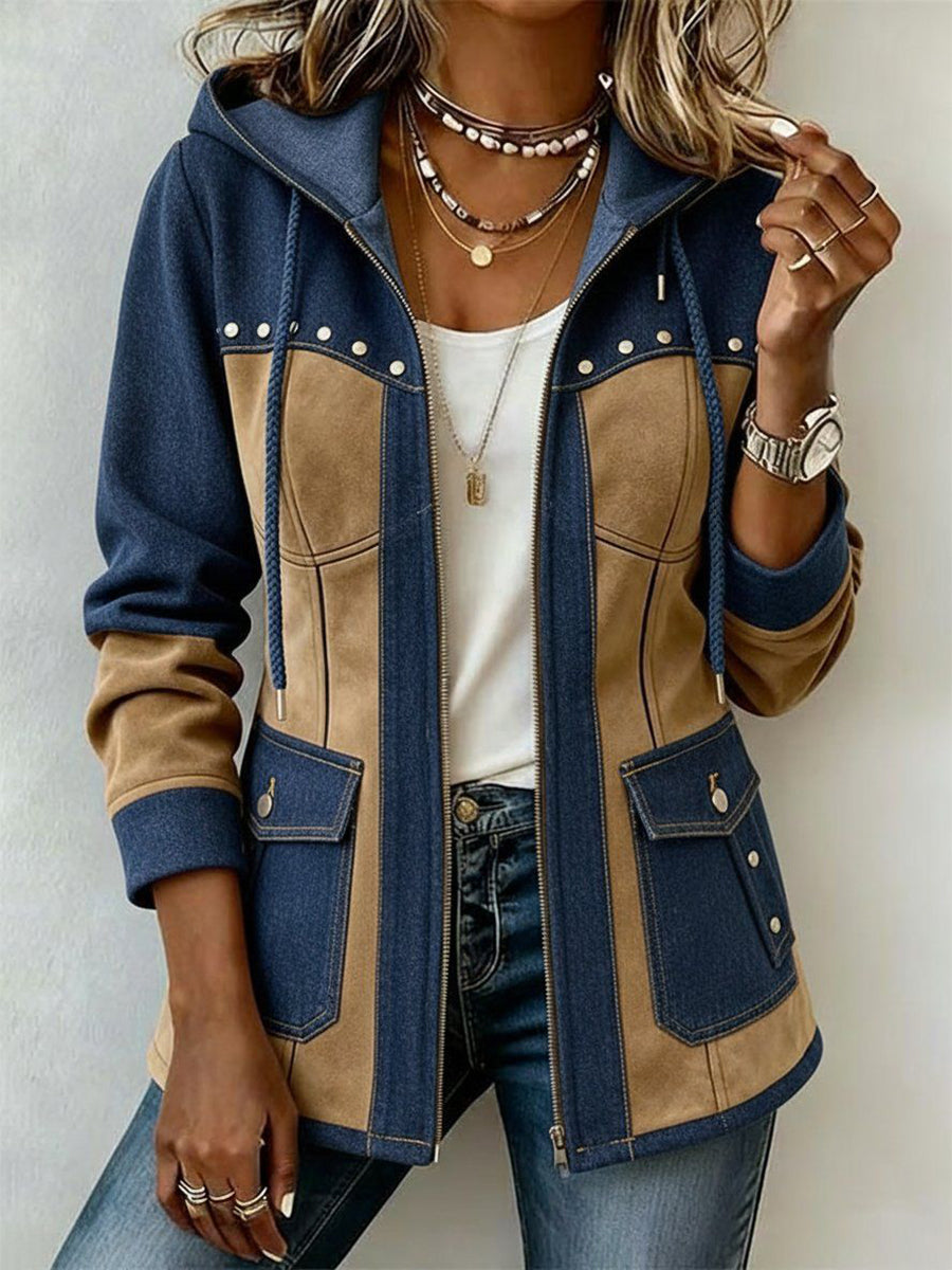 Woman wearing navy and camel hooded jacket with chest studs