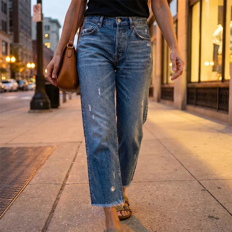 Woman wearing cropped straight leg jeans in blue