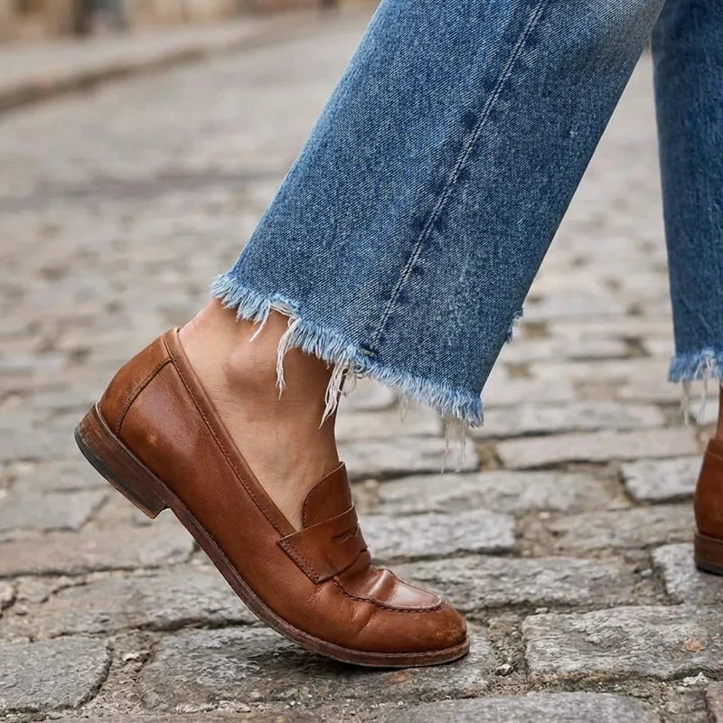 Woman wearing cropped straight leg jeans in blue